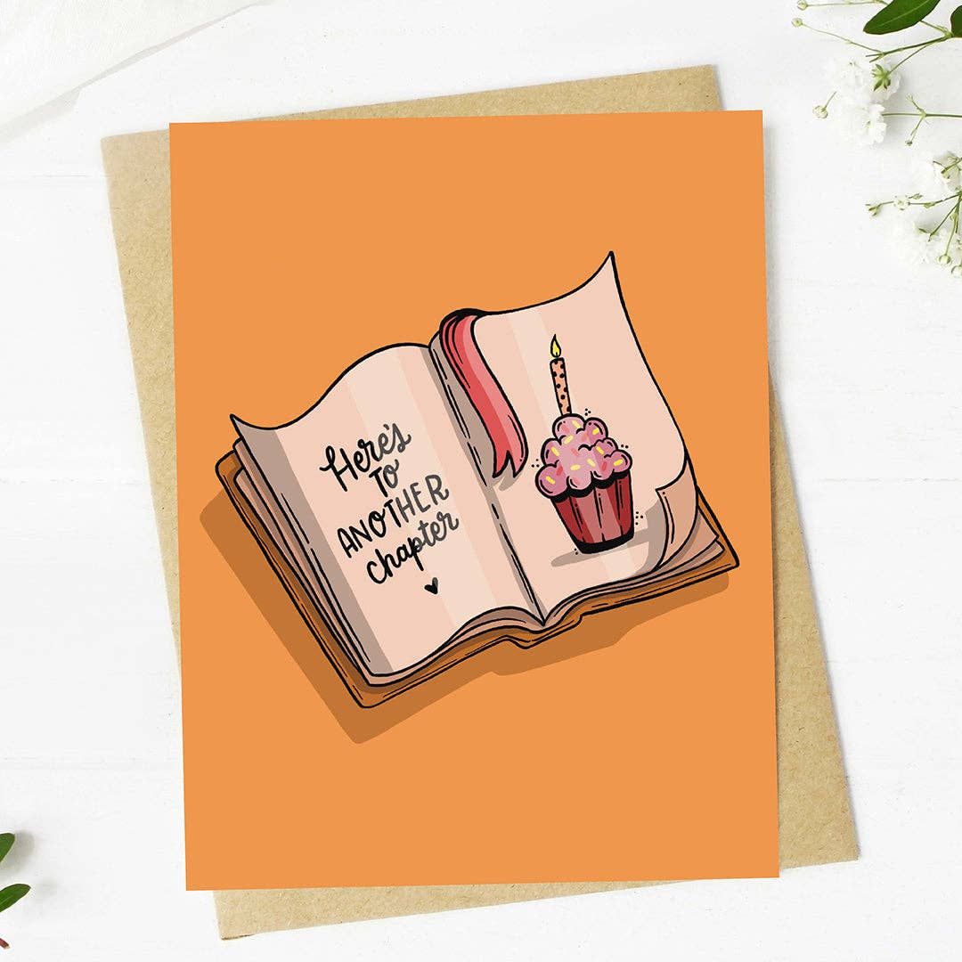 "Here's to another chapter" Bookish Birthday Card