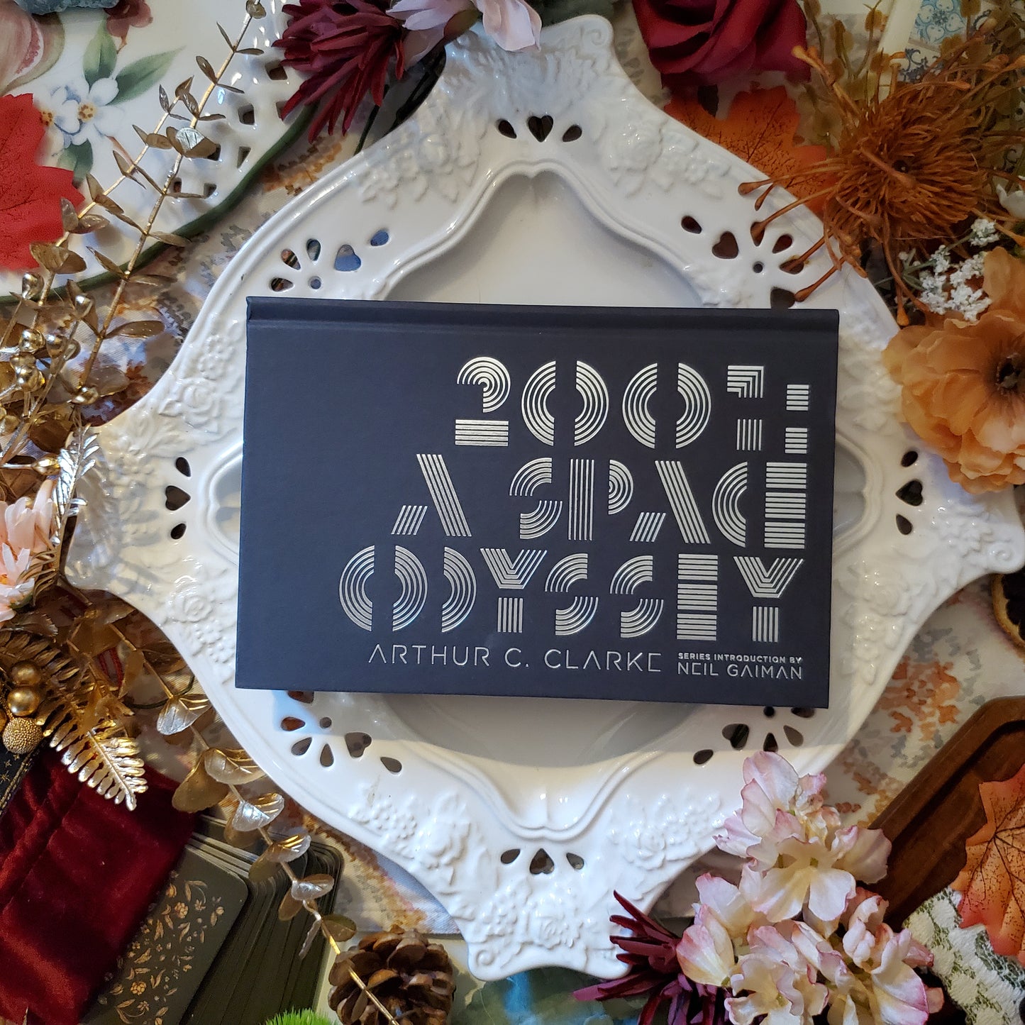 Hardcover edition of 2001: A Space Odyssey by Arthur C Clarke. The cover is solid back with the typography covering most of the space in silver decorative font.