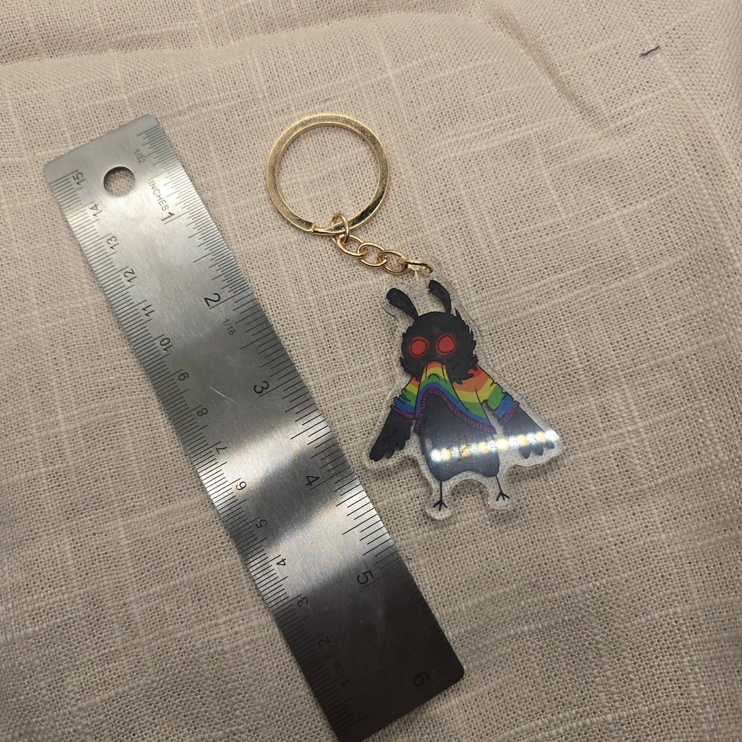 Mothman Eating His Own Rainbow Sweater Keychain