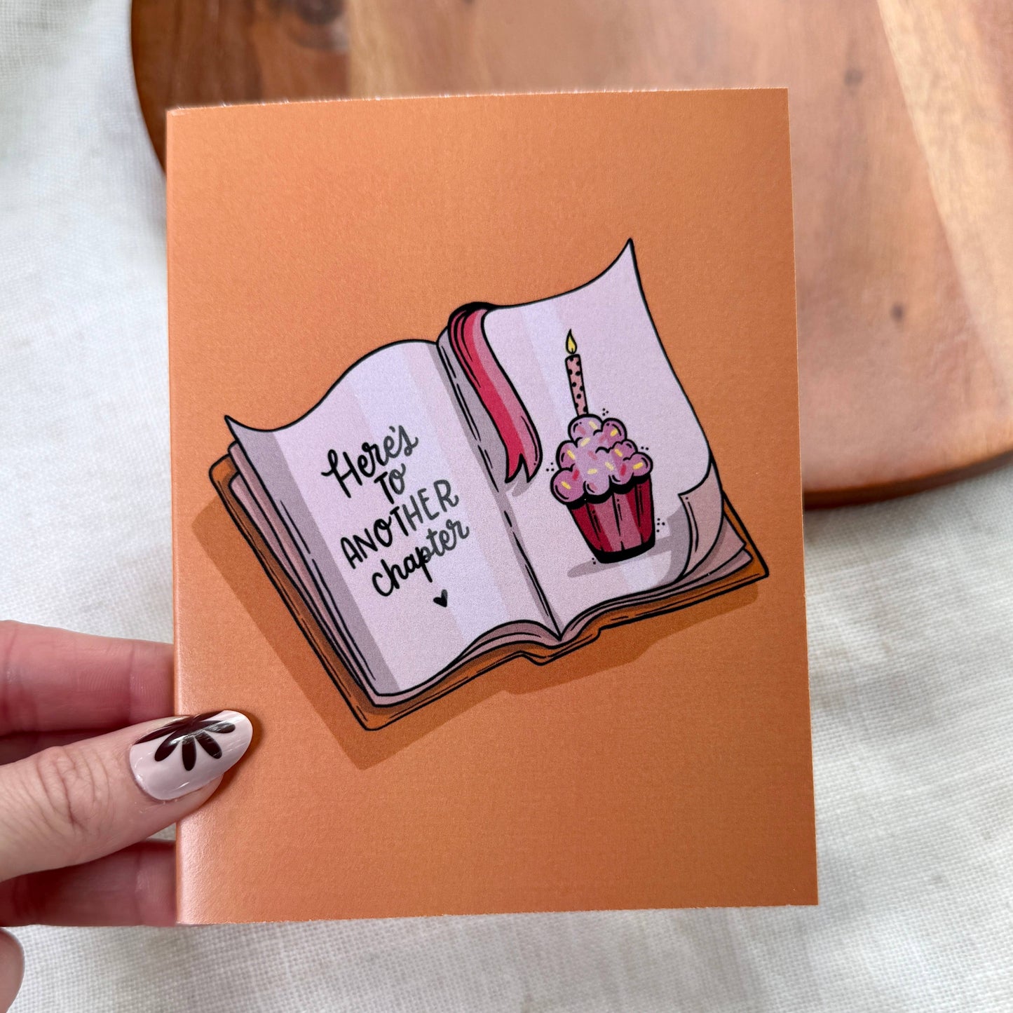 "Here's to another chapter" Bookish Birthday Card