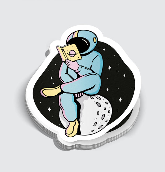 Astronaut Reading While on Moon Sticker - 3"