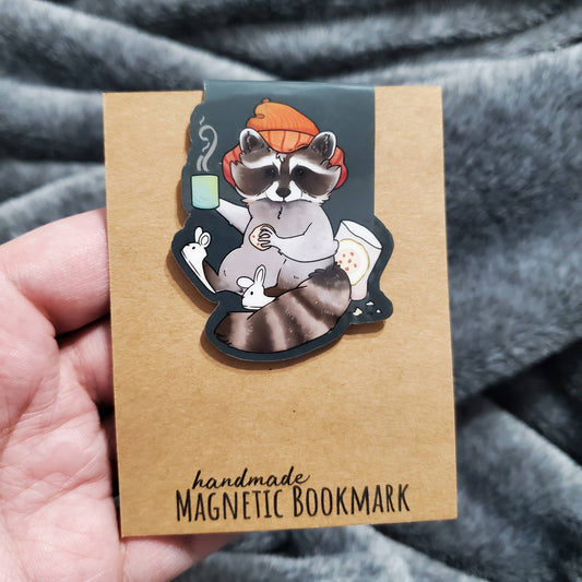 Cozy Raccoon with Hot Beverage and Cookies Magnetic Bookmark