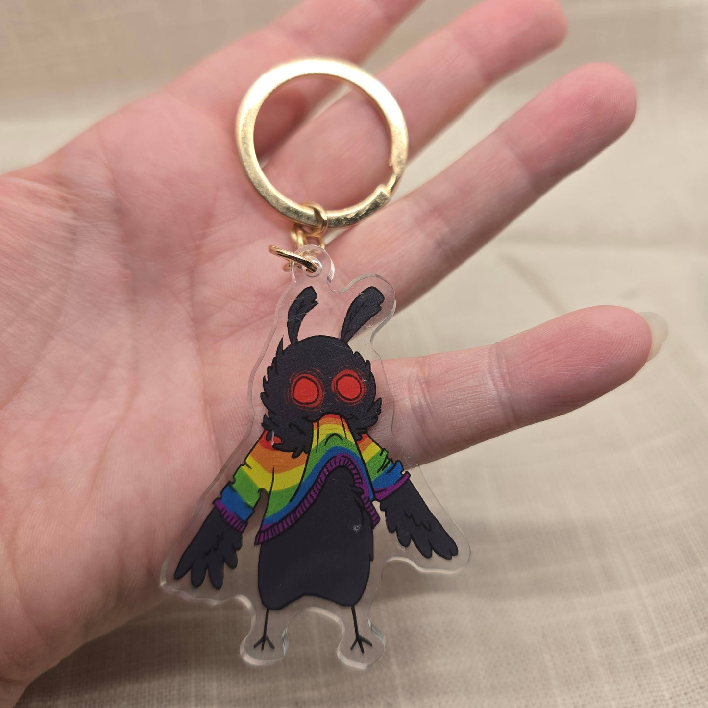 Mothman Eating His Own Rainbow Sweater Keychain