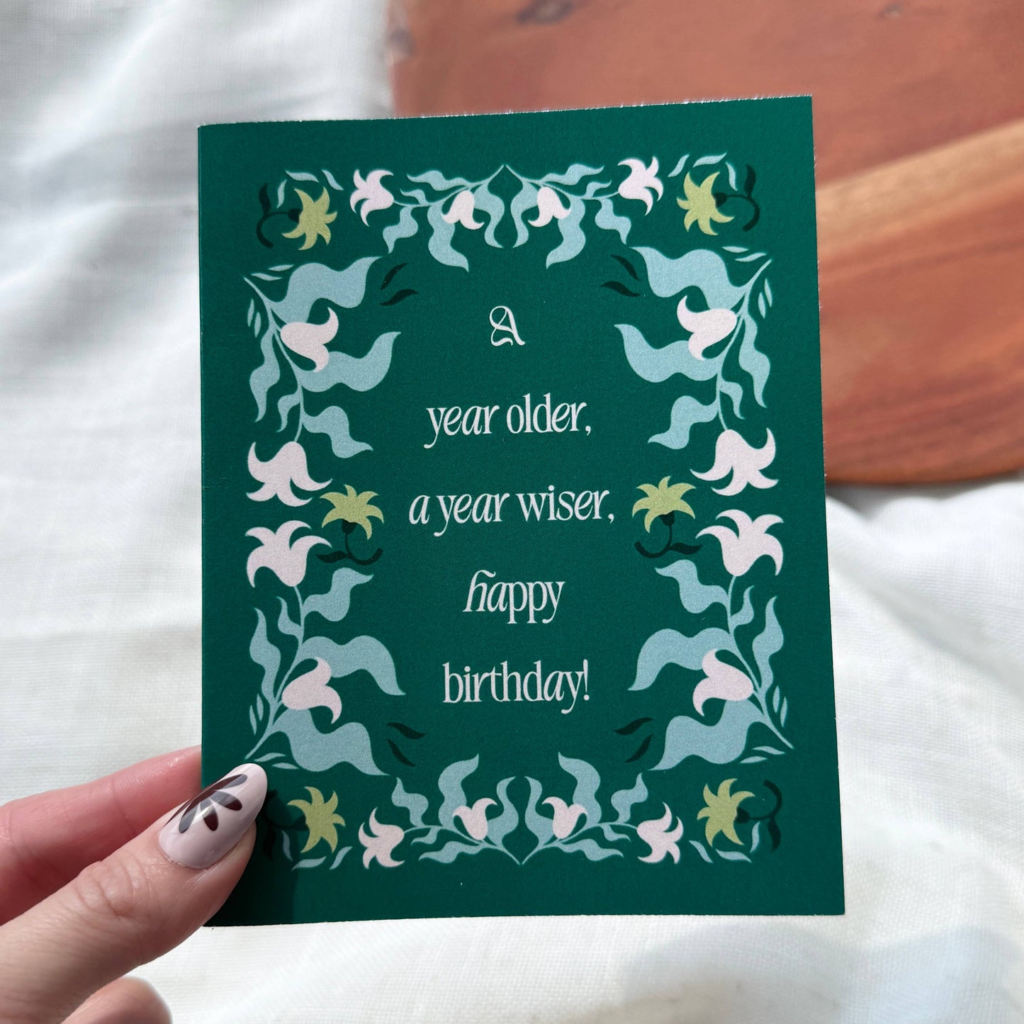 "A year older, a year wiser. Happy birthday!" Greeting Card
