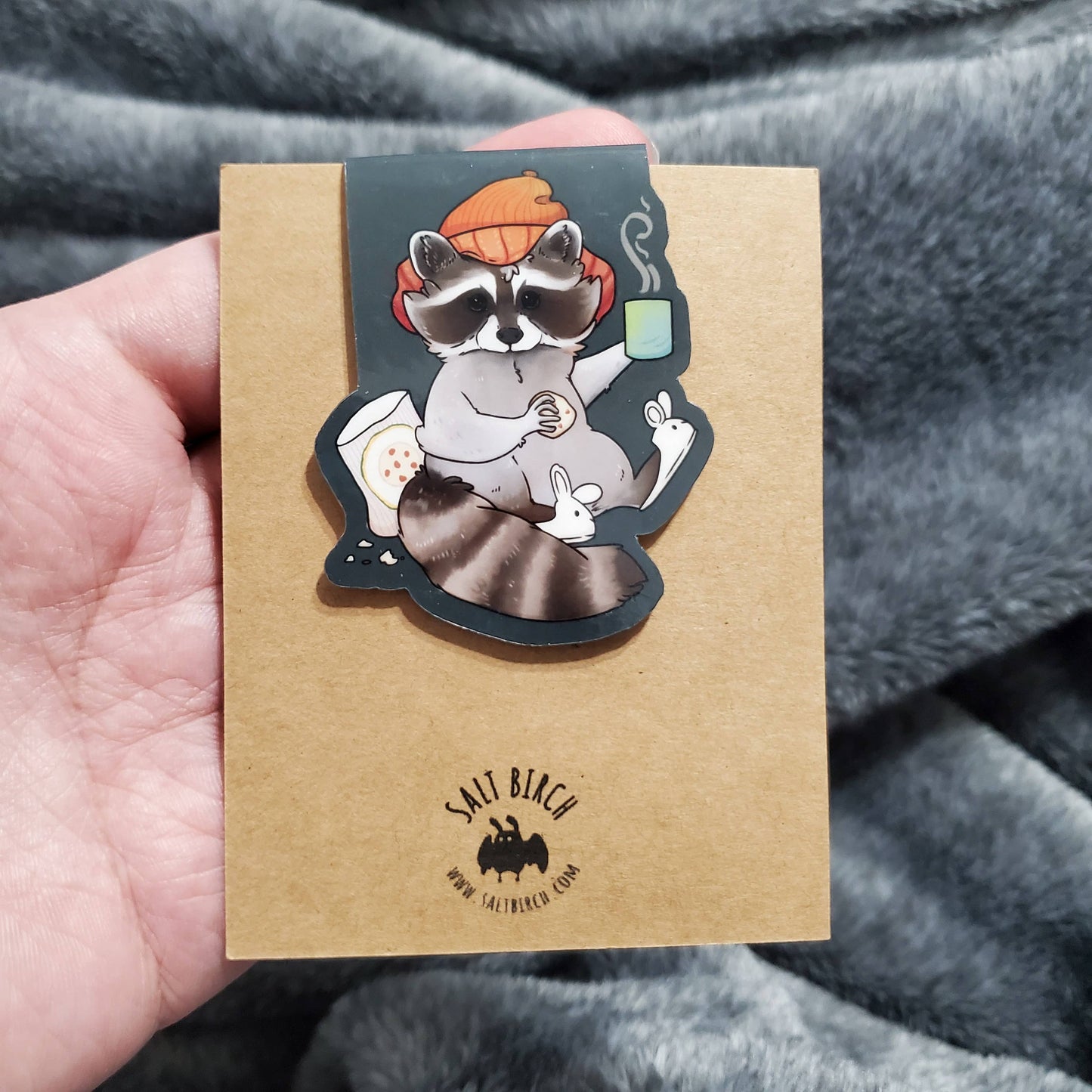 Cozy Raccoon with Hot Beverage and Cookies Magnetic Bookmark