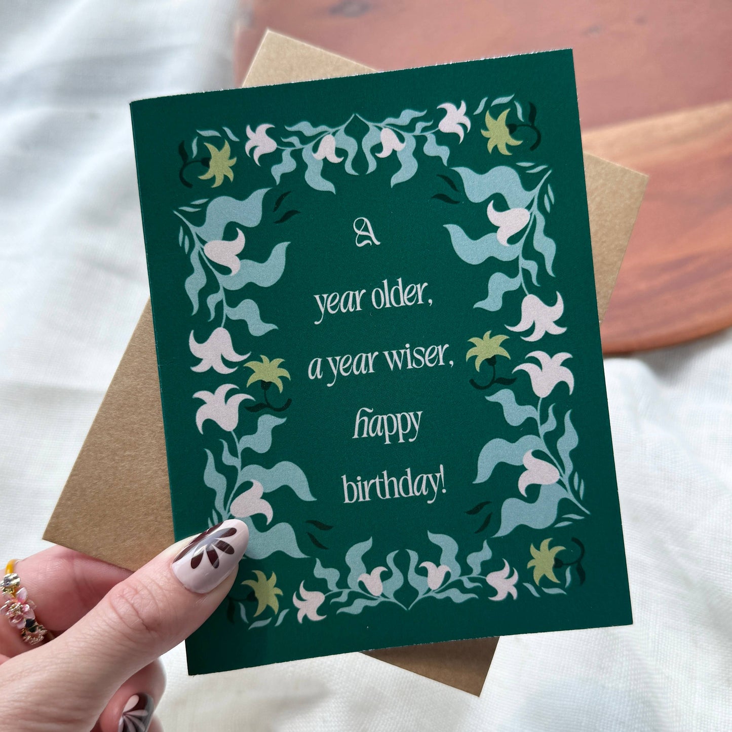 "A year older, a year wiser. Happy birthday!" Greeting Card